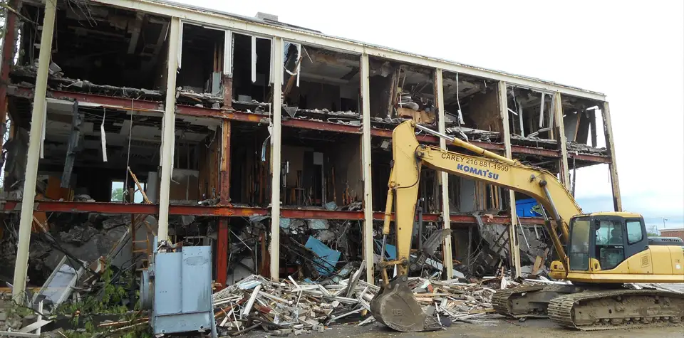 Carey Demolition backhoe tearing down an old commercial building in downtown Cleveland Ohio